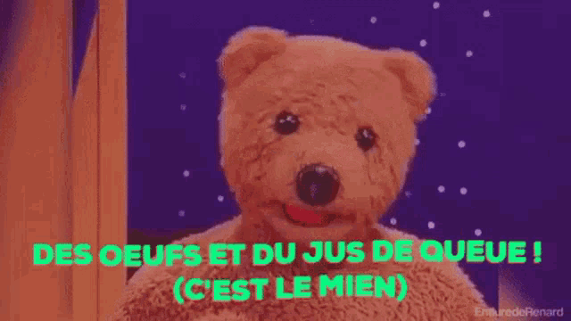 a teddy bear with the words des oeufs et du jus de queue