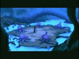 a computer screen shows a cartoon scene with purple octopus