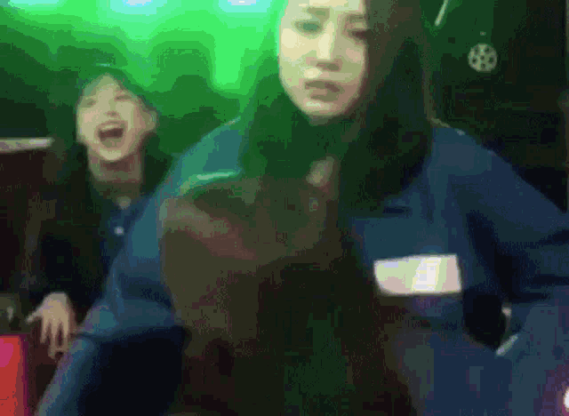 a woman in a blue jacket has a name tag on her chest that says ' amanda '