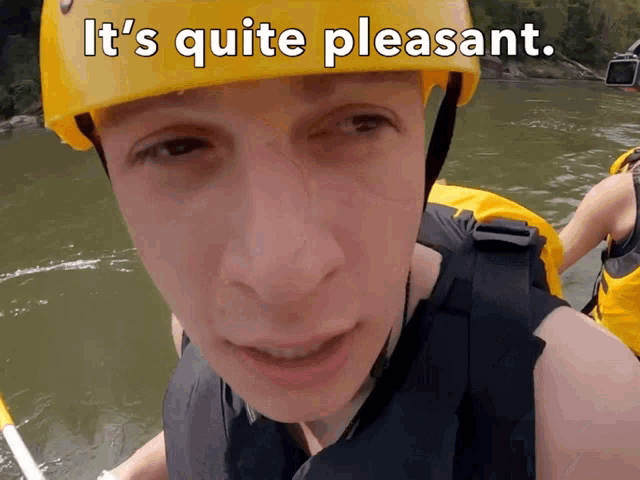 a man wearing a yellow helmet with the words it 's quite pleasant