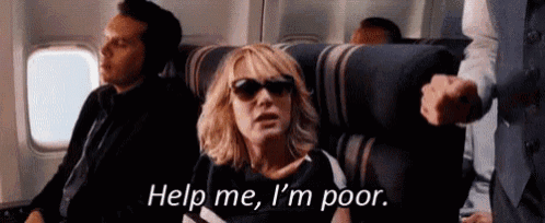 a woman wearing sunglasses is sitting on an airplane and asking for help .