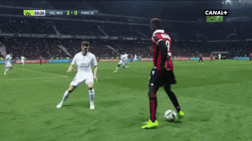 a soccer player with the number 9 on his jersey is kicking the ball
