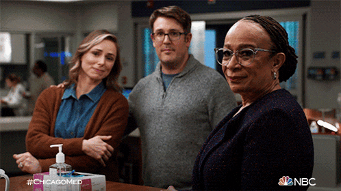 a group of people standing next to each other with a nbc logo in the corner