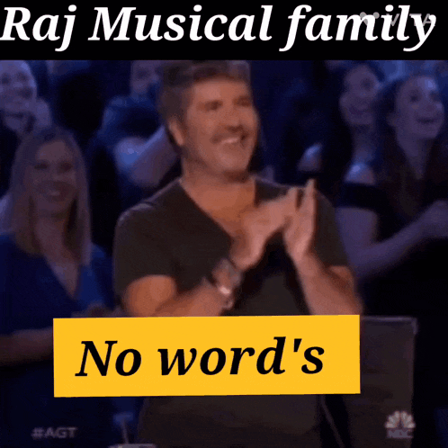 a man clapping in front of a crowd with a sign that says no word 's on it
