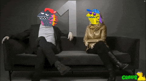a man and a woman are sitting on a couch with a number one in the background