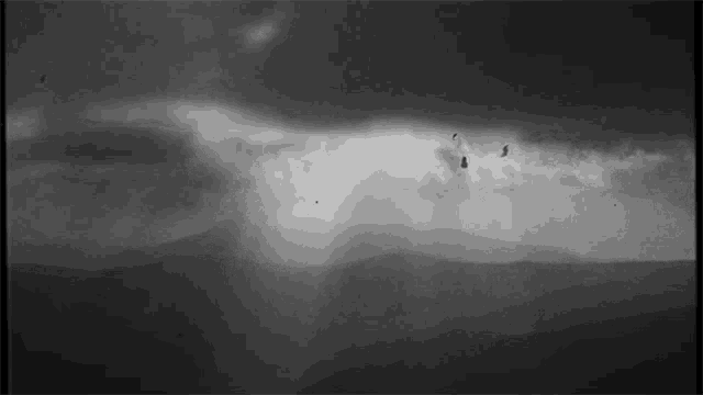a black and white photo of a cloudy sky