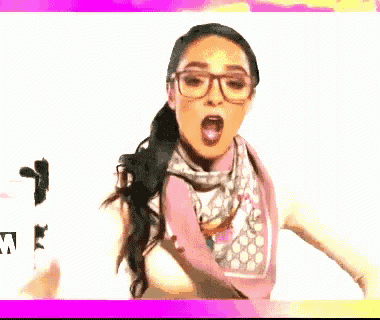 a woman wearing glasses and a scarf is making a surprised face