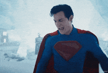 a man in a superman costume is screaming