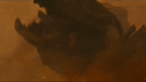 a close up of a monster in a smokey area .