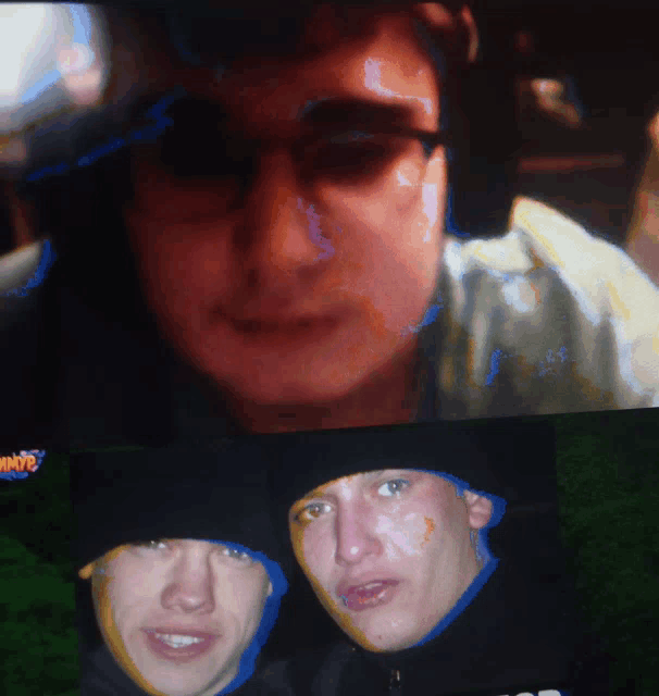 a screen shows a man 's face and another man 's face with the word shots on the bottom left