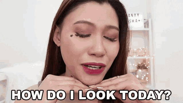 a woman is making a face with her hands and says `` how do i look today '' .