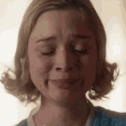 a close up of a woman 's face with her eyes closed .