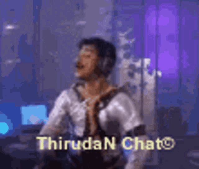 a man wearing headphones is dancing in a room with the words thiruda n chat written on the bottom .