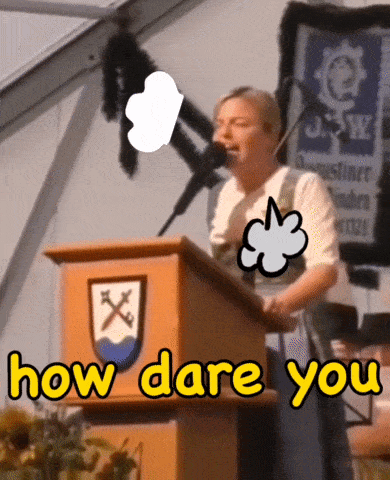 a woman stands behind a podium with the words " how dare you " written on it