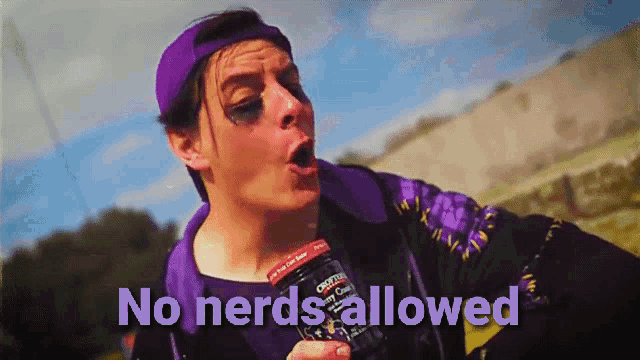 a man in a purple hat is holding a bottle that says no nerds allowed on it