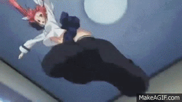 a woman is falling from the ceiling while a man is standing next to her .