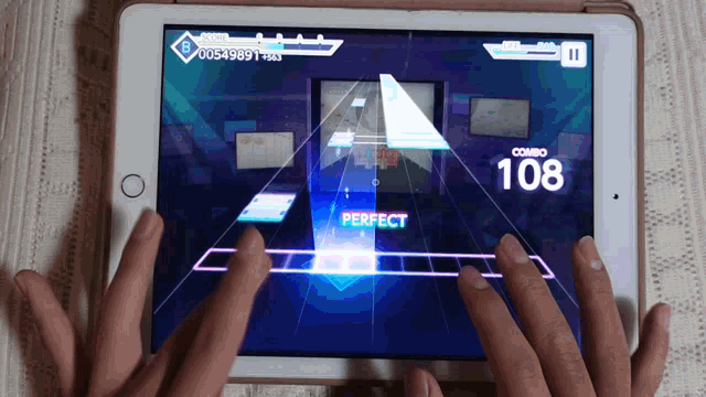 a person playing a game on a tablet that says perfect