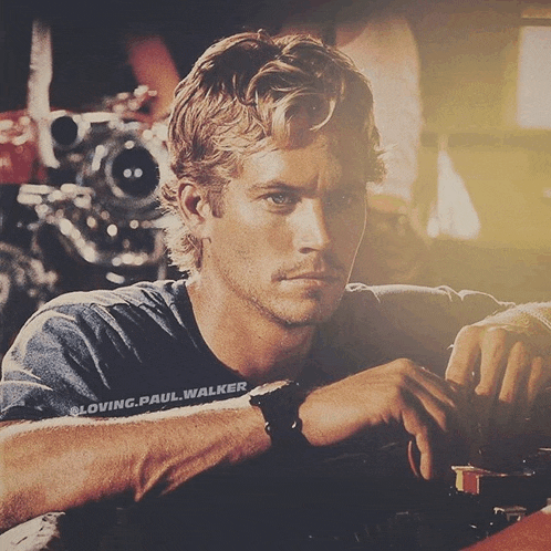 a close up of a man 's face with loving paul walker written on the bottom