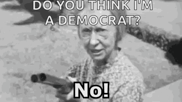 an elderly woman is holding a gun in a black and white photo and asking if she is a democrat .