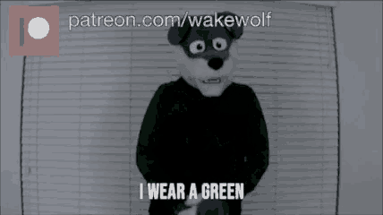 a video of a wolf with the words i wear a green on the bottom