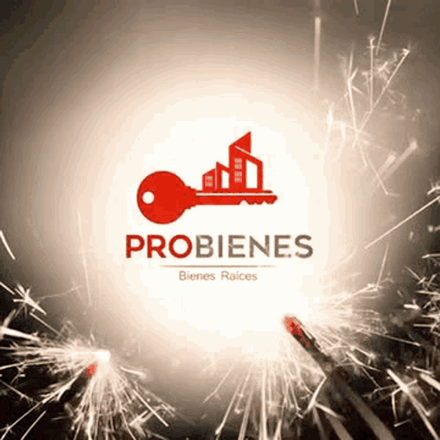 a logo for a real estate company with a key and a building on it surrounded by sparklers .