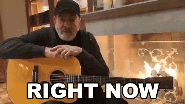 a man playing a guitar in front of a fireplace with the words right now below him