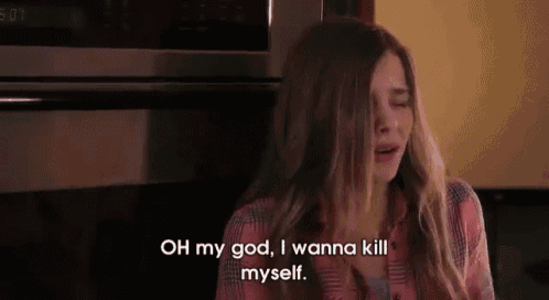 a woman is crying in front of a microwave and saying `` oh my god , i wanna kill myself '' .