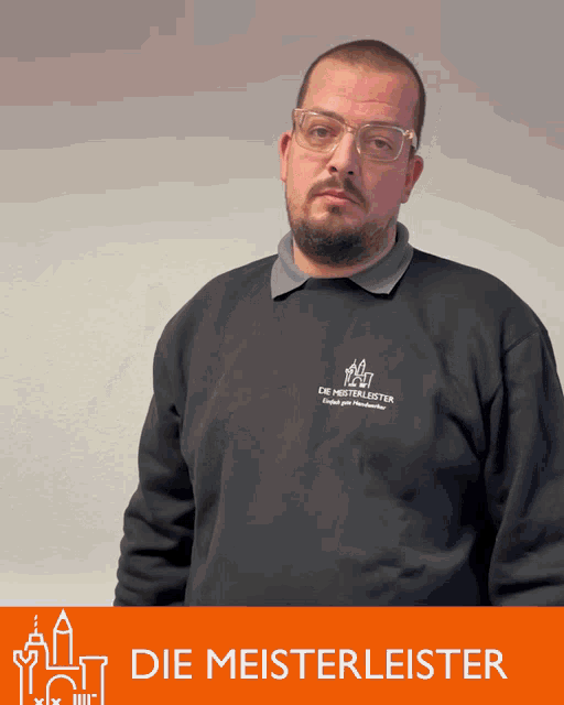 a man wearing glasses and a black shirt that says die meistermeister