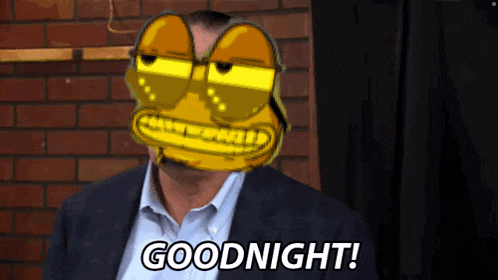 a man in a suit says goodnight with a cartoon face