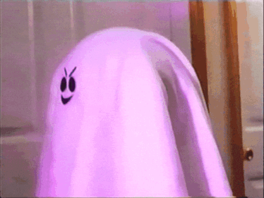 a purple ghost with a smiley face on it 's face