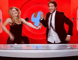 a man and a woman are dancing on a stage
