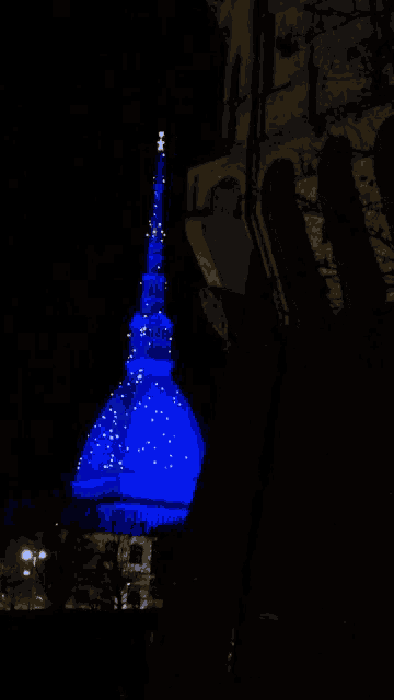 a building with a blue dome and a star on top