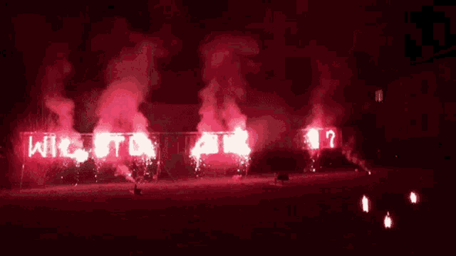 a fireworks display at night with the words wilston written on it