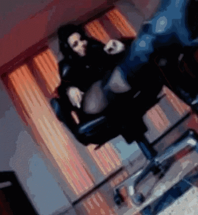 a blurry picture of a person laying on a chair