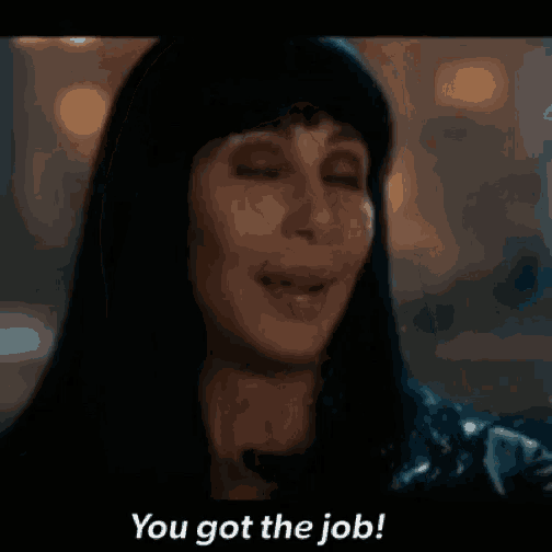 a close up of a woman 's face with the words `` you got the job '' below her .
