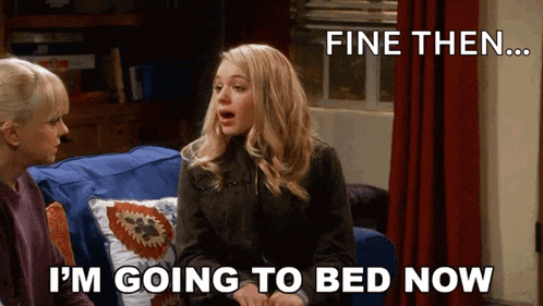 two women are sitting on a couch and one of them says " fine then i 'm going to bed now "