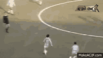 a group of soccer players on a field with a makeagif.com logo
