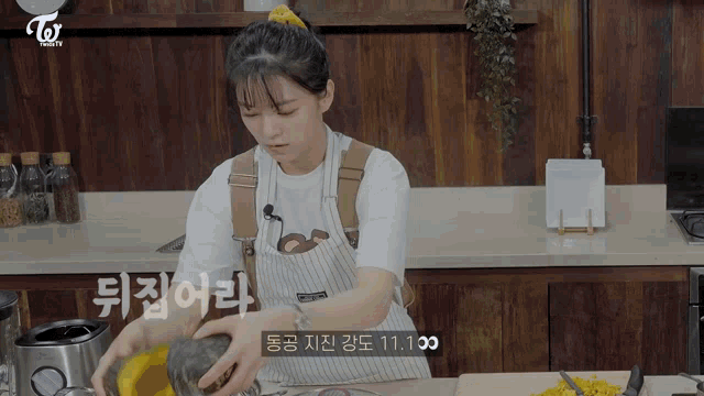 a woman in an apron is preparing food in a kitchen with a sign that says 11.100