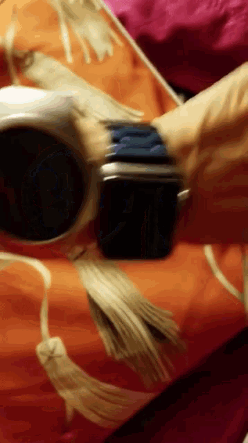a person is wearing a watch on their wrist