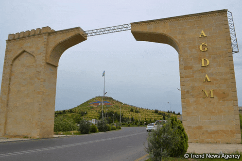 a large stone archway with the word agdam on it