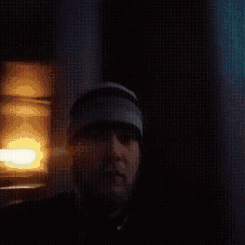 a blurry picture of a man in a hat