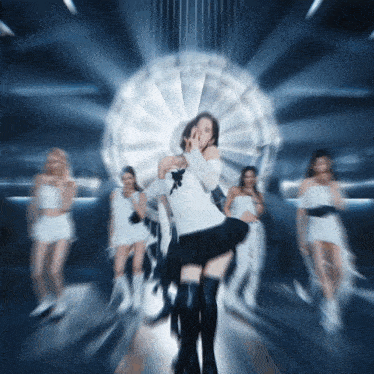 a blurry picture of a woman dancing in front of a ferris wheel