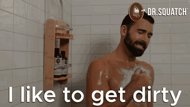 a man taking a shower with the words " i like to get dirty " above him