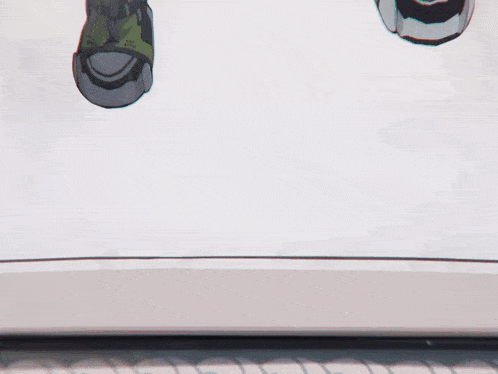 a close up of a person 's feet wearing a pair of green and black shoes