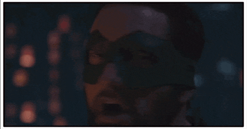 a man with a green mask on his face