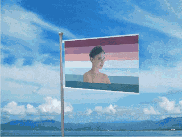 a flag with a picture of a woman in it