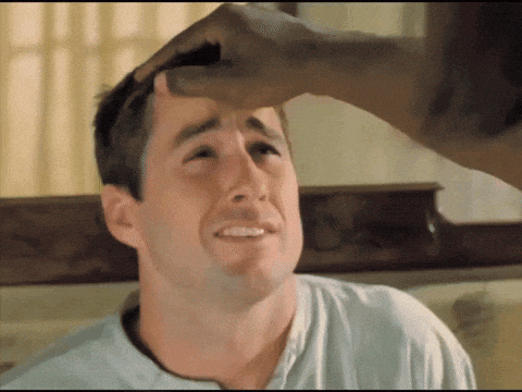 a man 's face is being touched by another man
