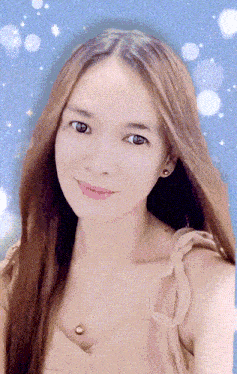 a close up of a woman 's face with a blue sky in the background