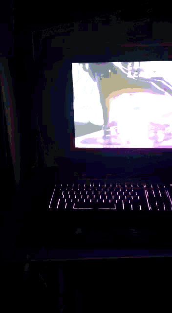 a laptop with a purple keyboard and a screen that says ' chess ' on it