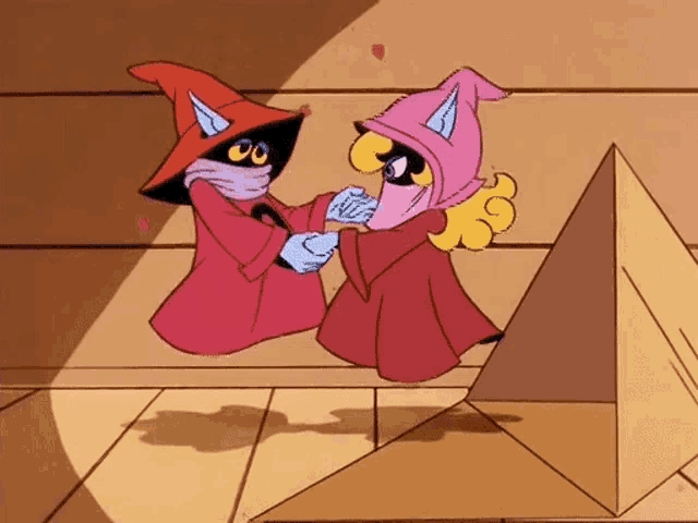 a couple of cartoon characters standing next to each other with a pyramid in the background